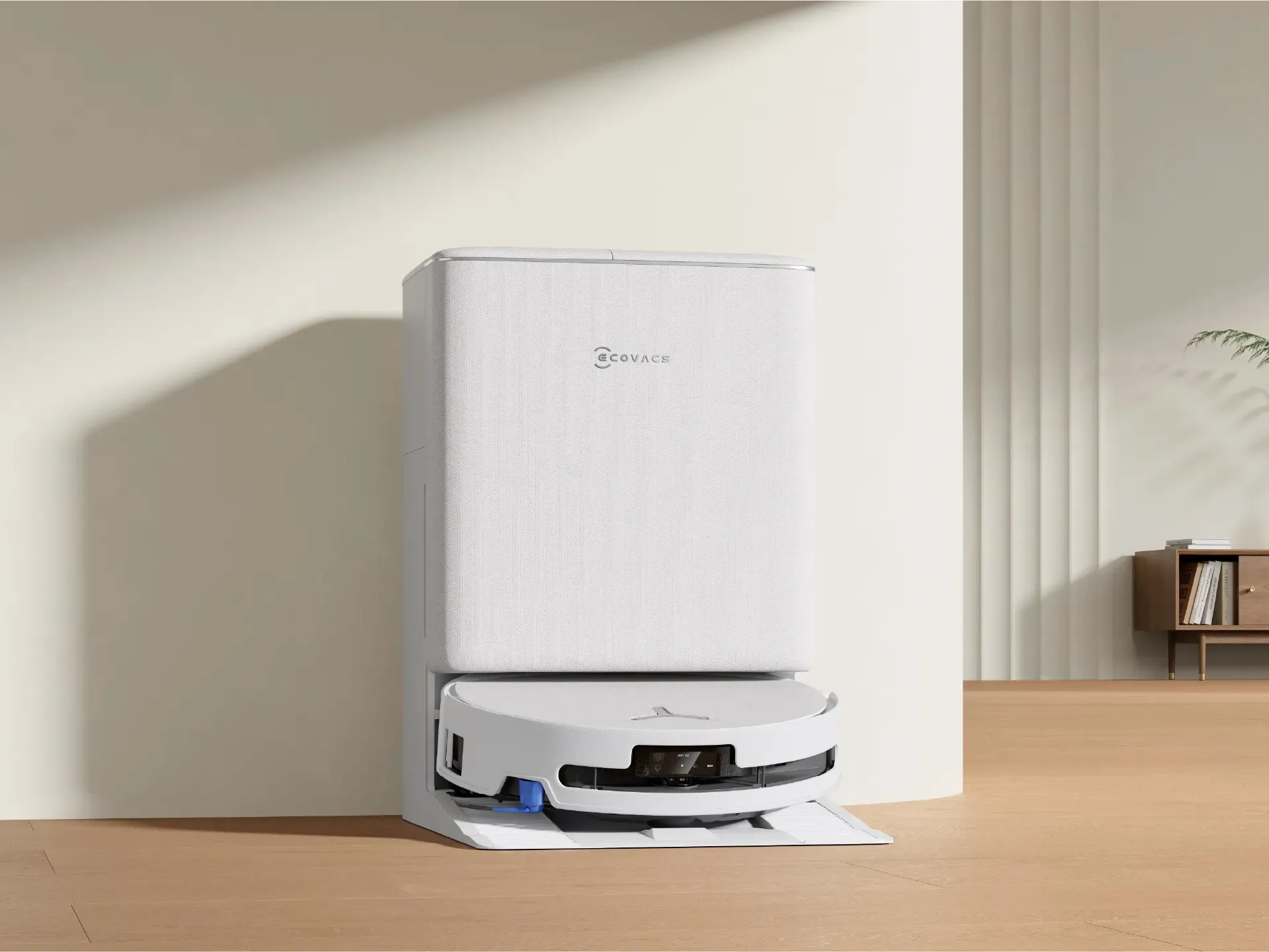Ecovacs Deebot T90 Pro Omni màu trắng cùng trạm sạc trong phòng khách